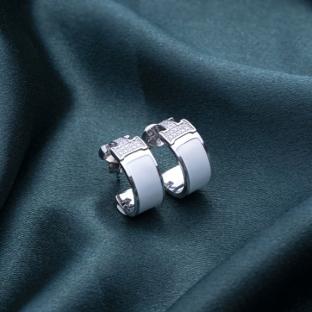 Reegalia Sparkling Hashtag Huggie Hoops – 925 Silver.